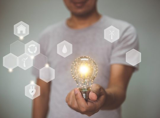 Hand holding light bulb. idea with environment and innovation .  innovative technology and solution creative business design concept.